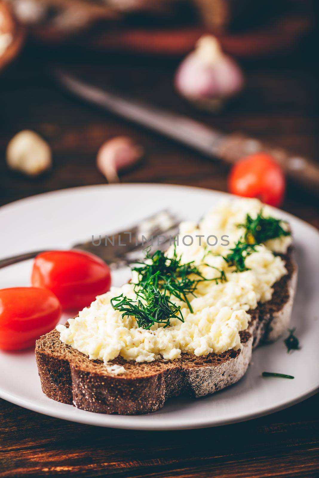 Rye bread toast with processed cheese, garlic and dill