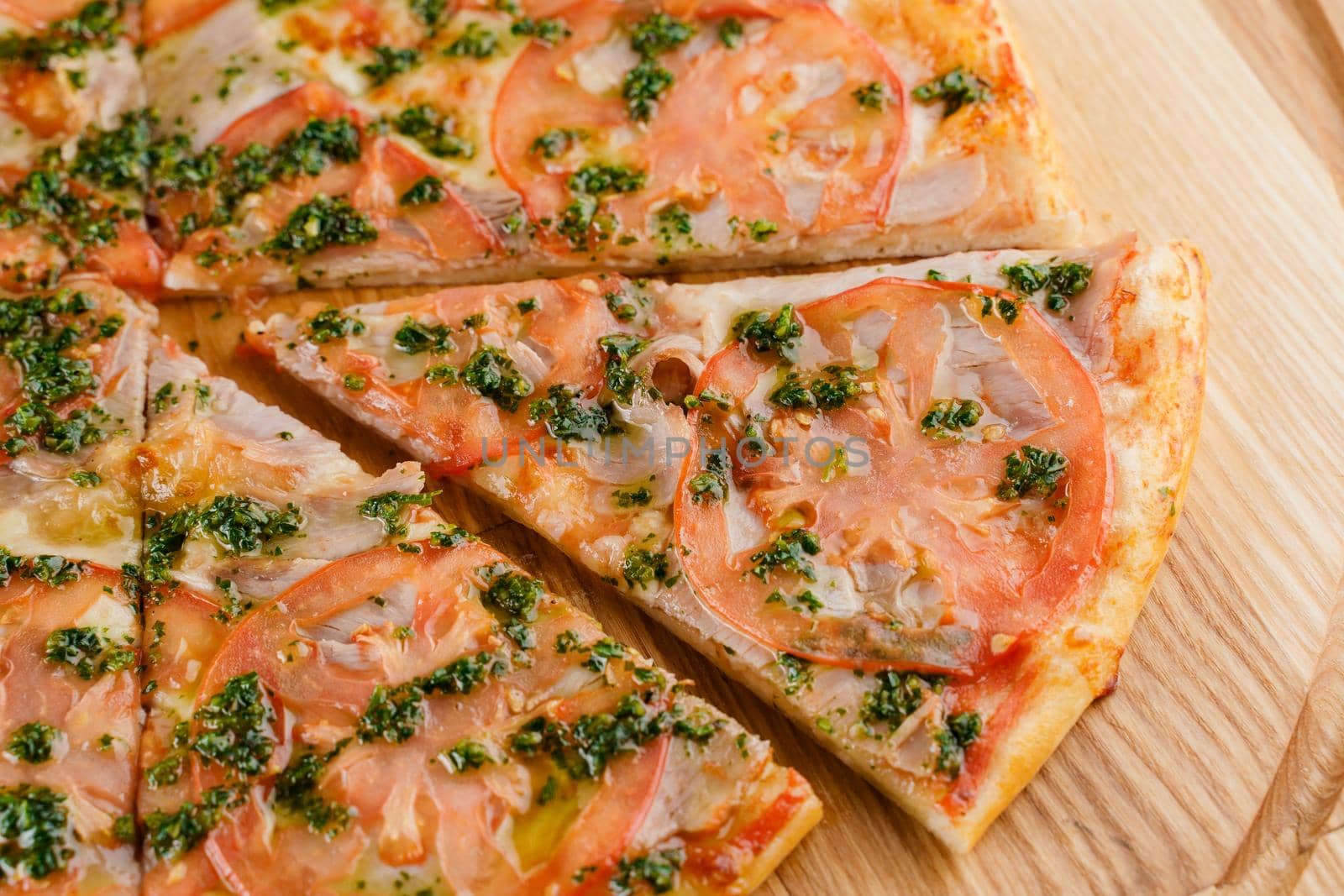 Pizza top view cutted on 8 pieces and one pushed forward. Advert for pizzeria caffee and restaurant. Food delivery at quarantine covid-19 concept.