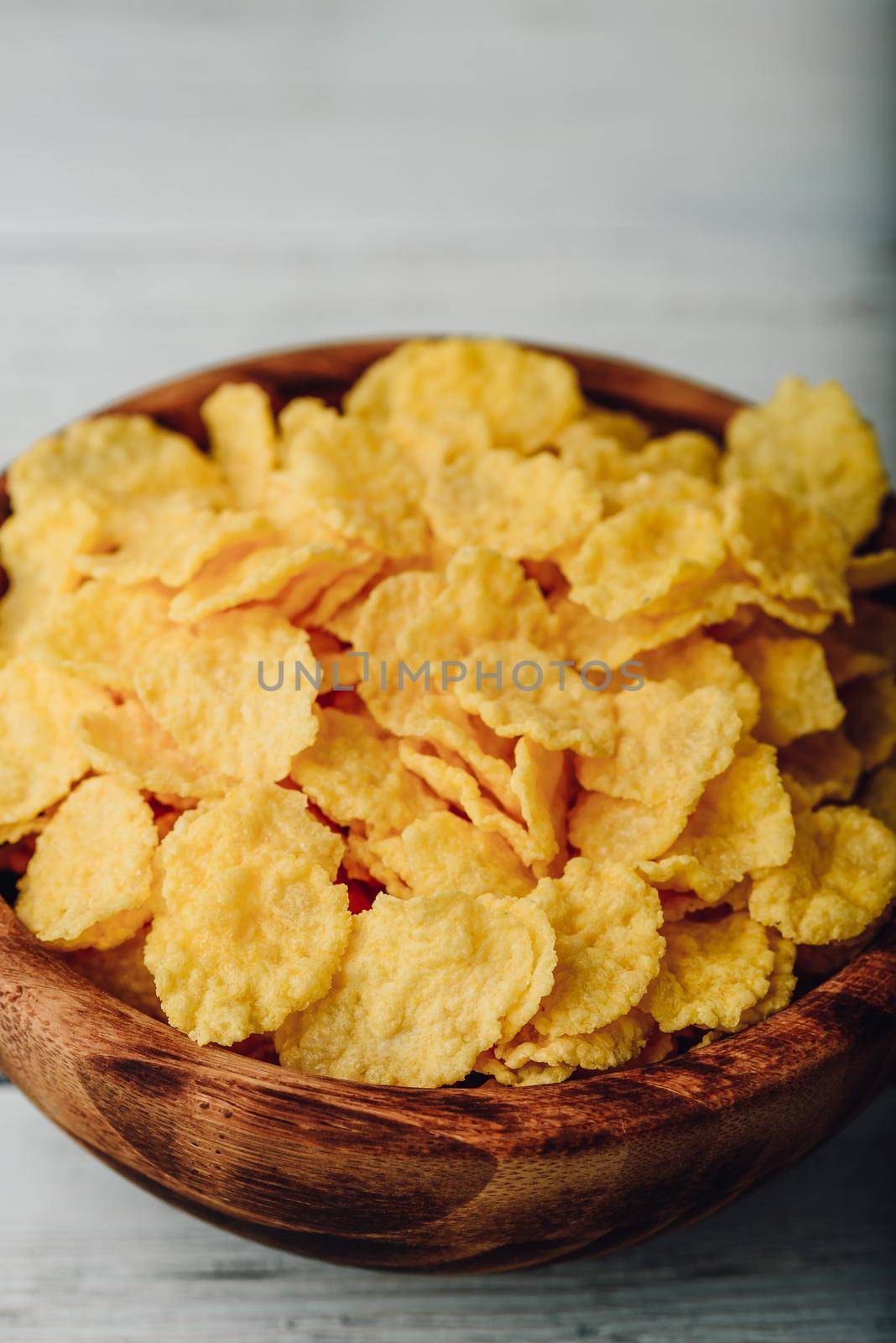 Breakfast cornflakes in a wooden bowl by Seva_blsv