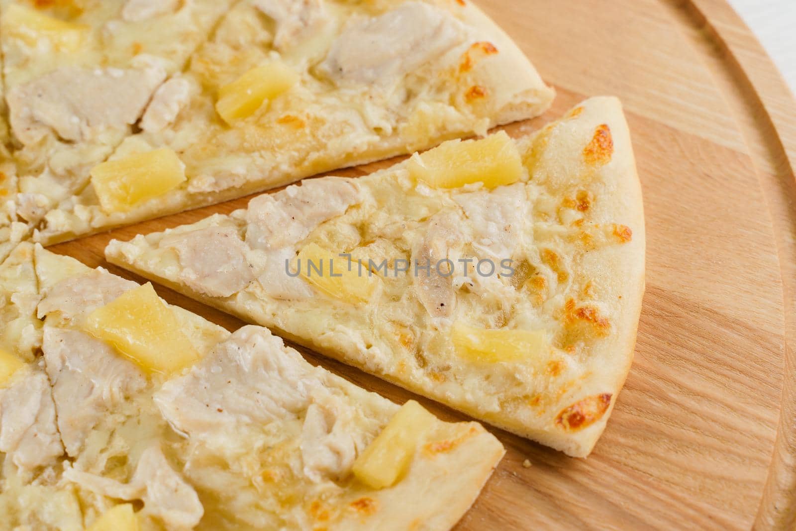 Pizza top view cutted on 8 pieces and one pushed forward. Advert for pizzeria caffee and restaurant. Food delivery at quarantine covid-19 concept
