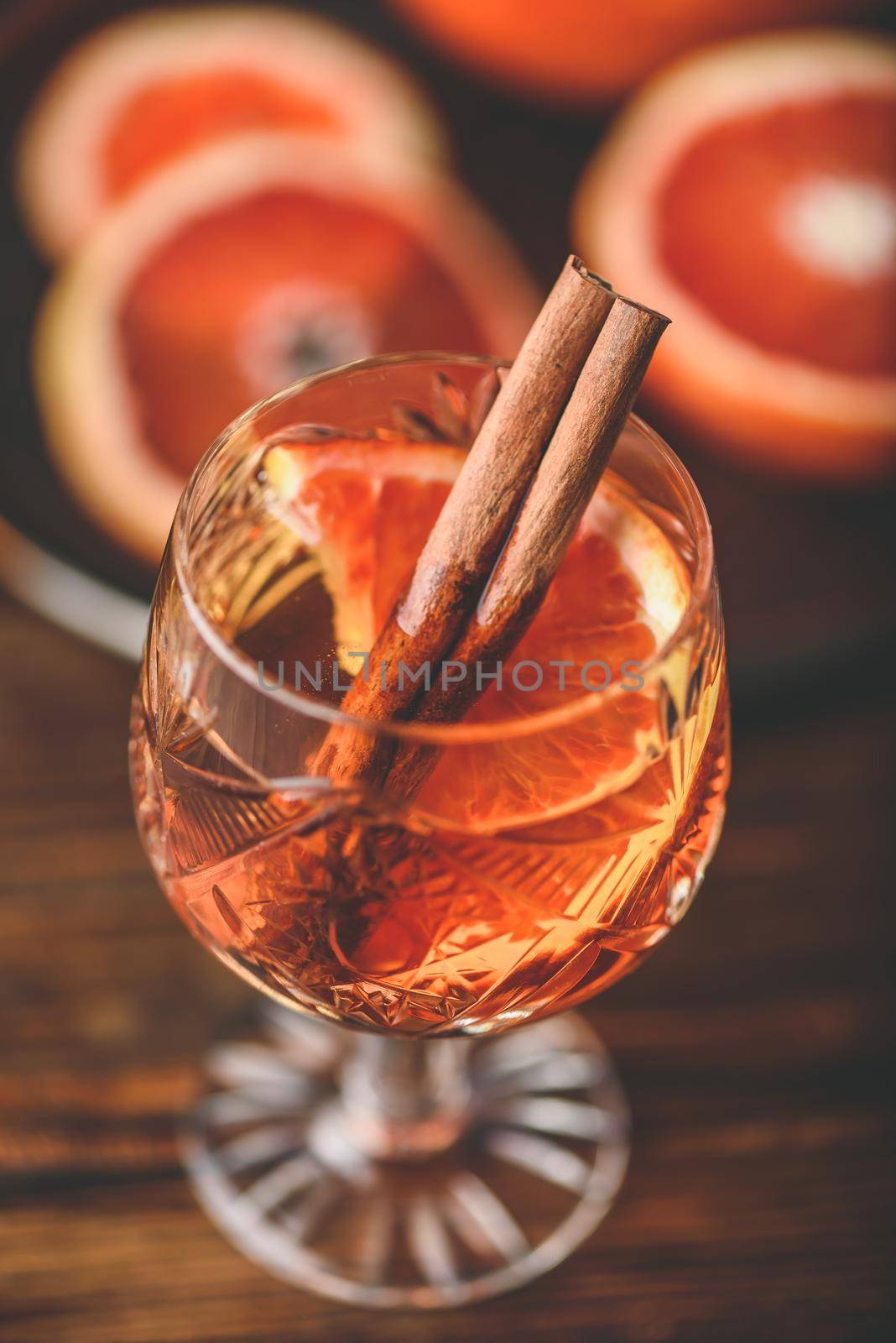 Glass of orange whiskey sour cocktail by Seva_blsv