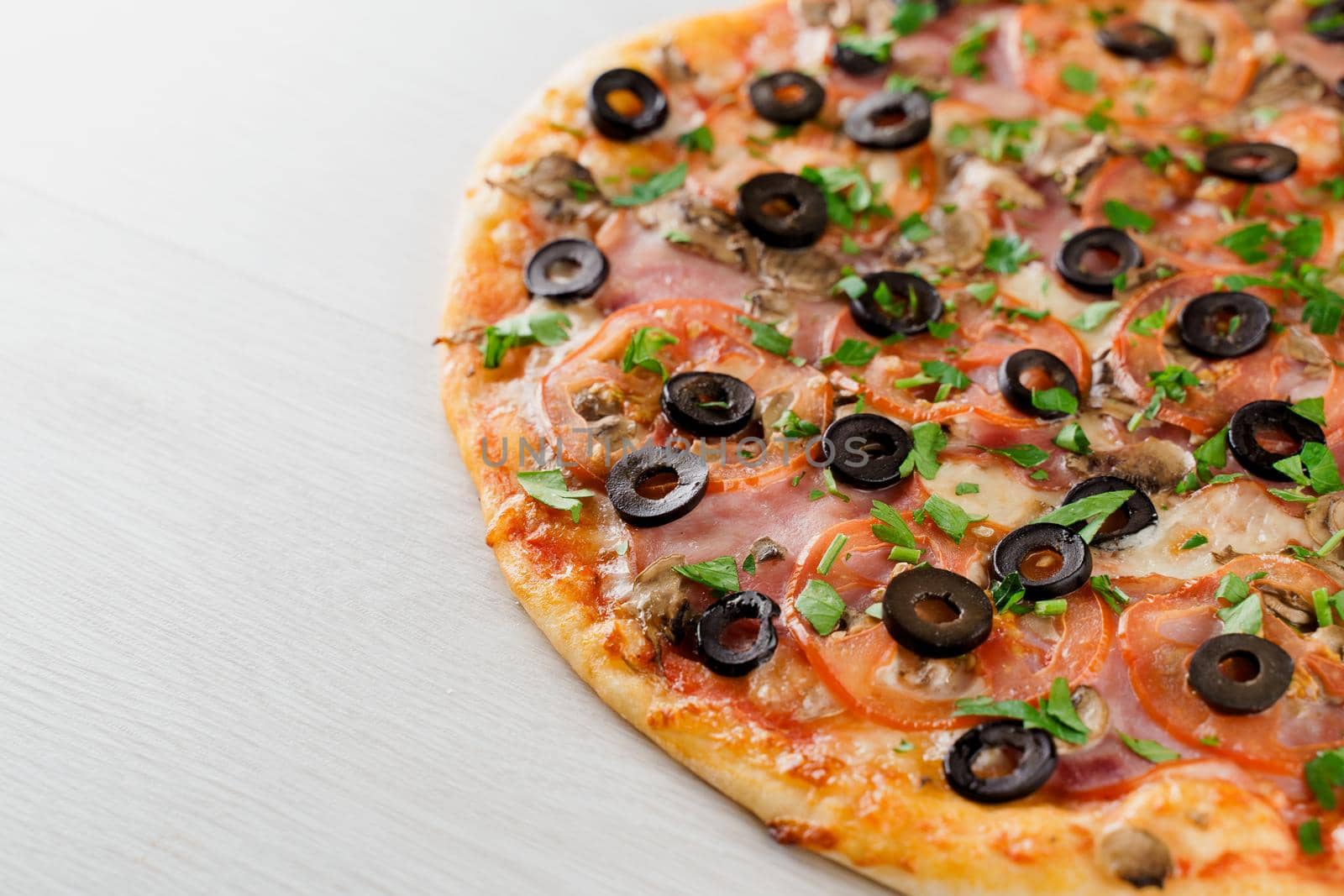 Big pizza isolated on white background. Tasty fast food at quarantine coronavirus covid-19 period. Food delivery for people who stay at home