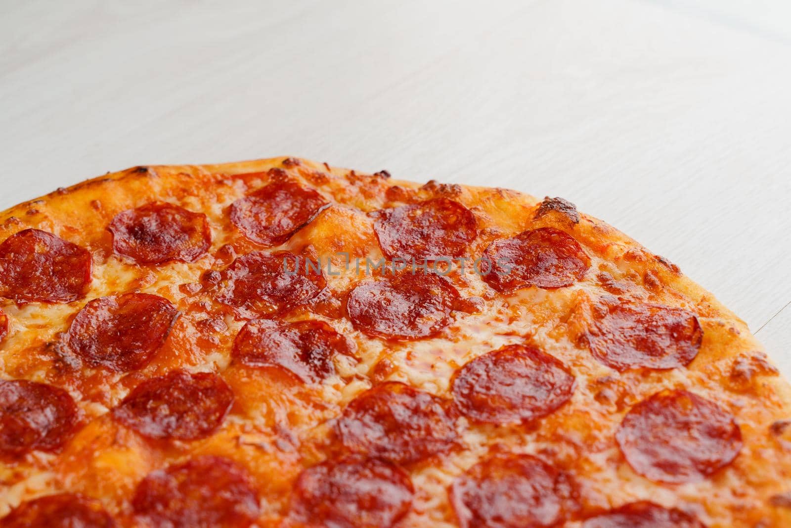 Big pizza isolated on white background. Tasty fast food at quarantine coronavirus covid-19 period. Food delivery for people who stay at home