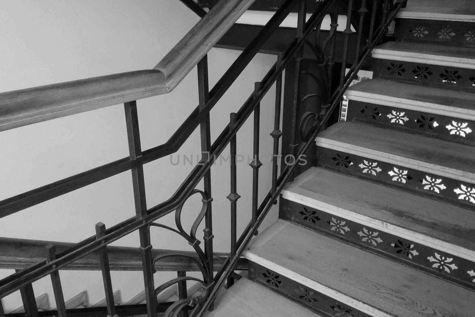 Black and white photo. Beautiful staircase in an old house