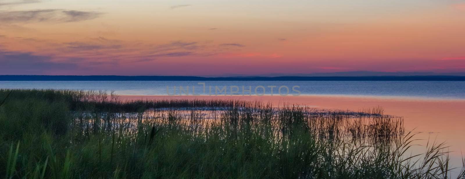 Beautiful pink sunset on the lake. Banner. by Laguna781