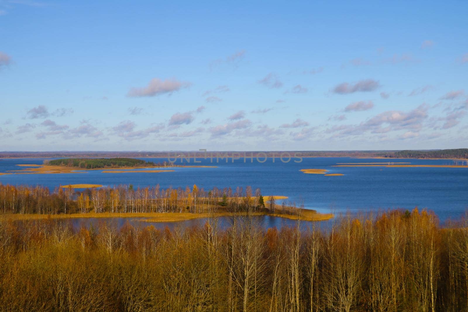 View from the top to a beautiful lake in autumn. Out of focus