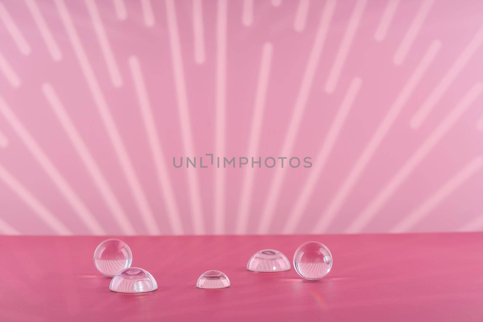 Cosmetic background podium for product presentation. Pink backdrop with transparent sphere decor, display balls mockup. Showcase mockup for perfume advertising, cosmetics stand, branding scene.