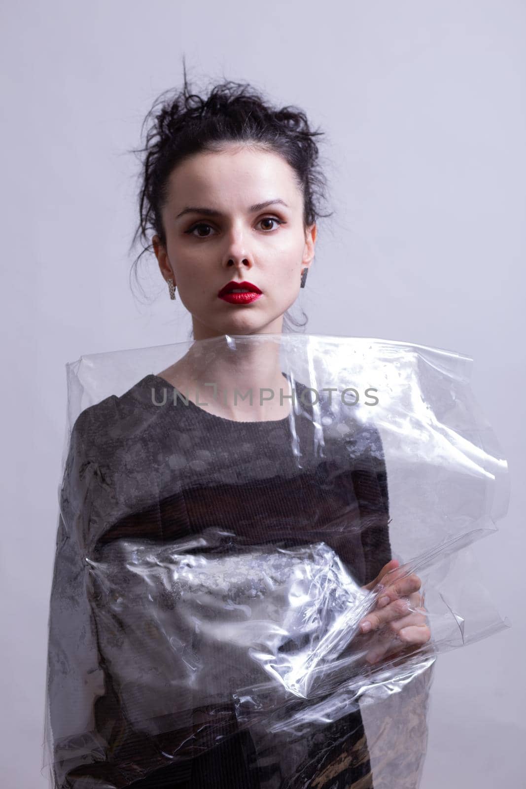 woman with red lips wrapped in plastic wrap by shilovskaya