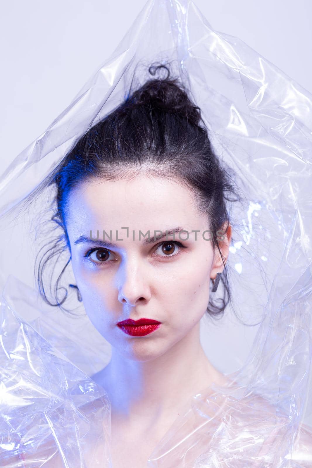 woman with red lips wrapped in plastic wrap by shilovskaya