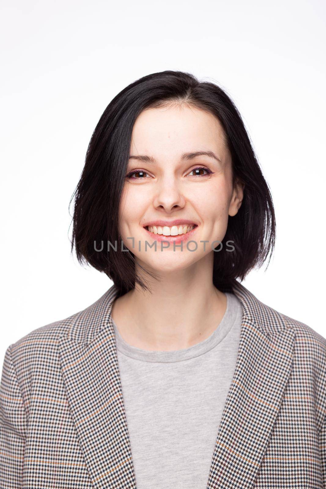 emotional woman in a gray t-shirt and jacket, white background by shilovskaya