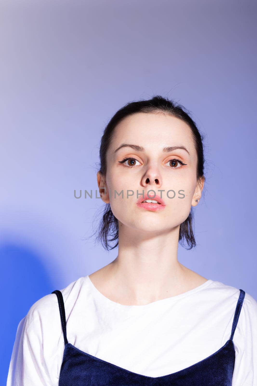beautiful brunette woman on blue background by shilovskaya
