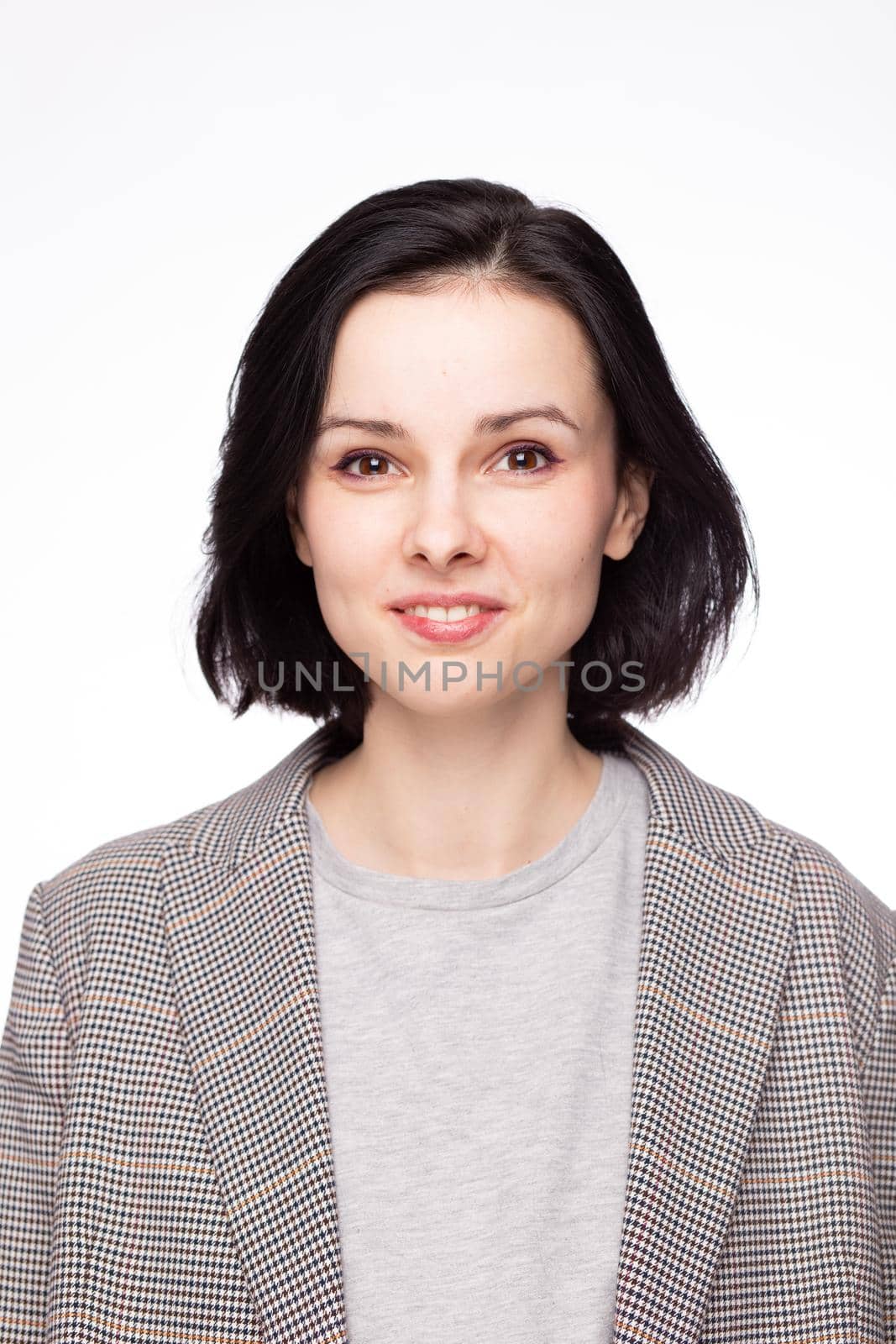 emotional woman in a gray t-shirt and jacket, white background by shilovskaya