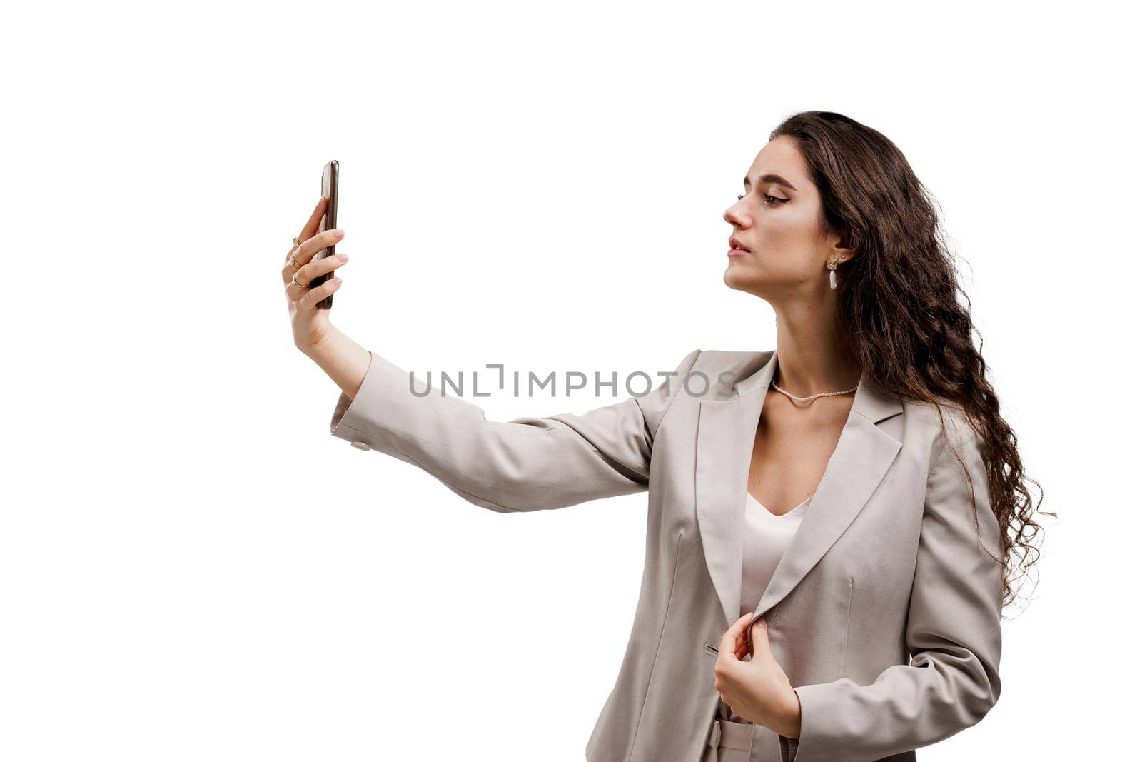 Young business woman does selfie isolated on white background. Attractive girl talking with her friends by video chats. On-line connection with family