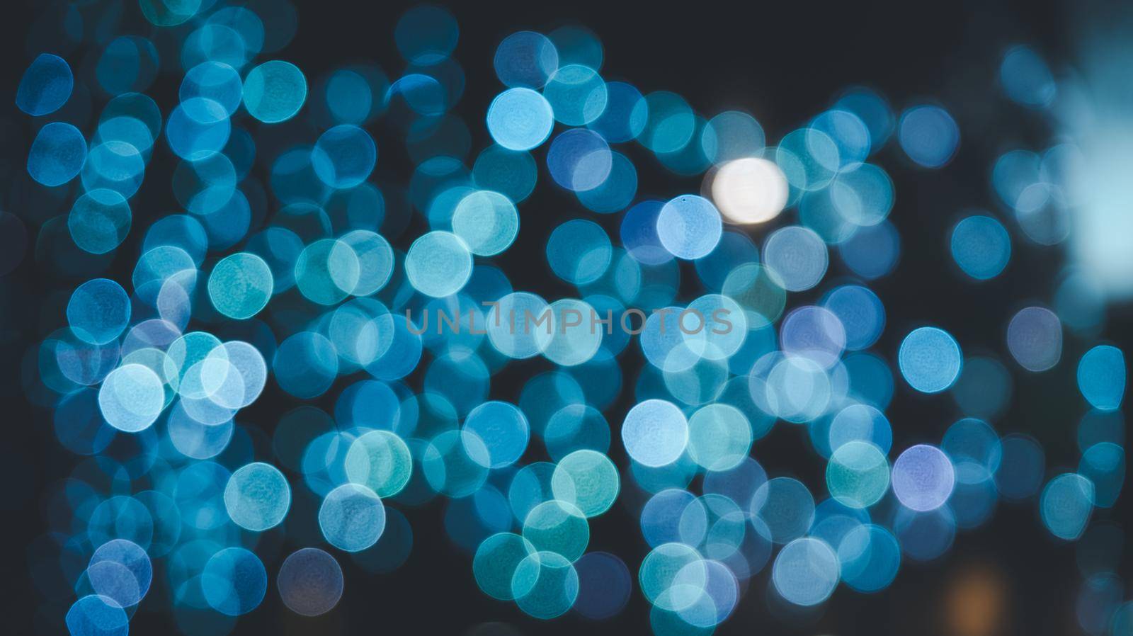 Abstract magical bokeh lights effect background, black, gold glitter for Christmas, for your banner, post. Glittering gold stars of bokeh use for celebrate background. by Wmpix
