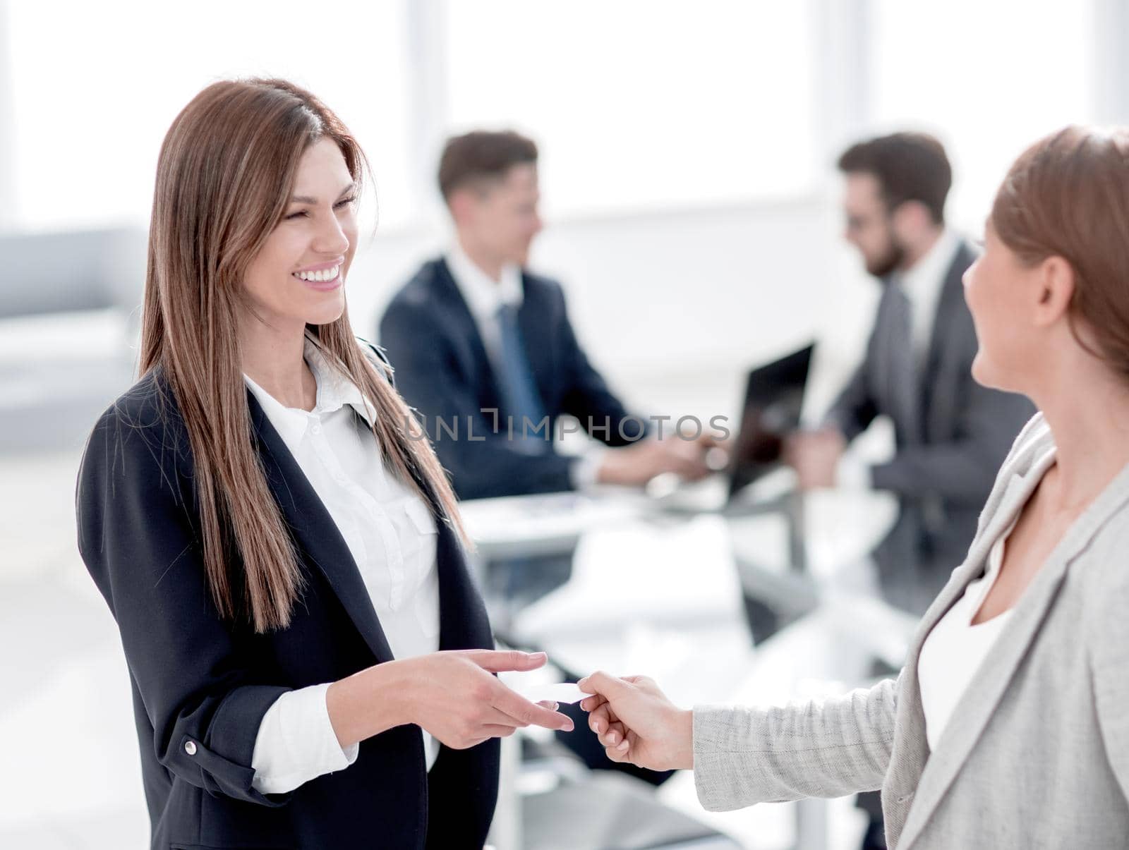 successful business woman gives her business card .business concept