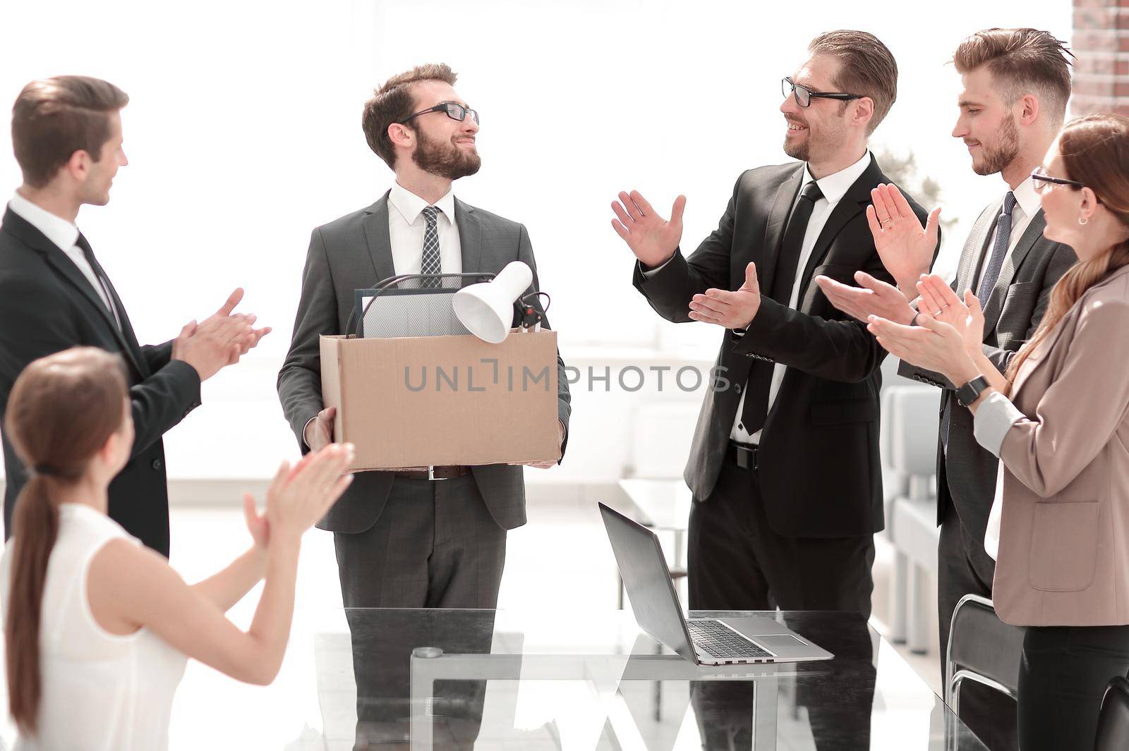 business team applauding at a meeting with the new employee. by asdf