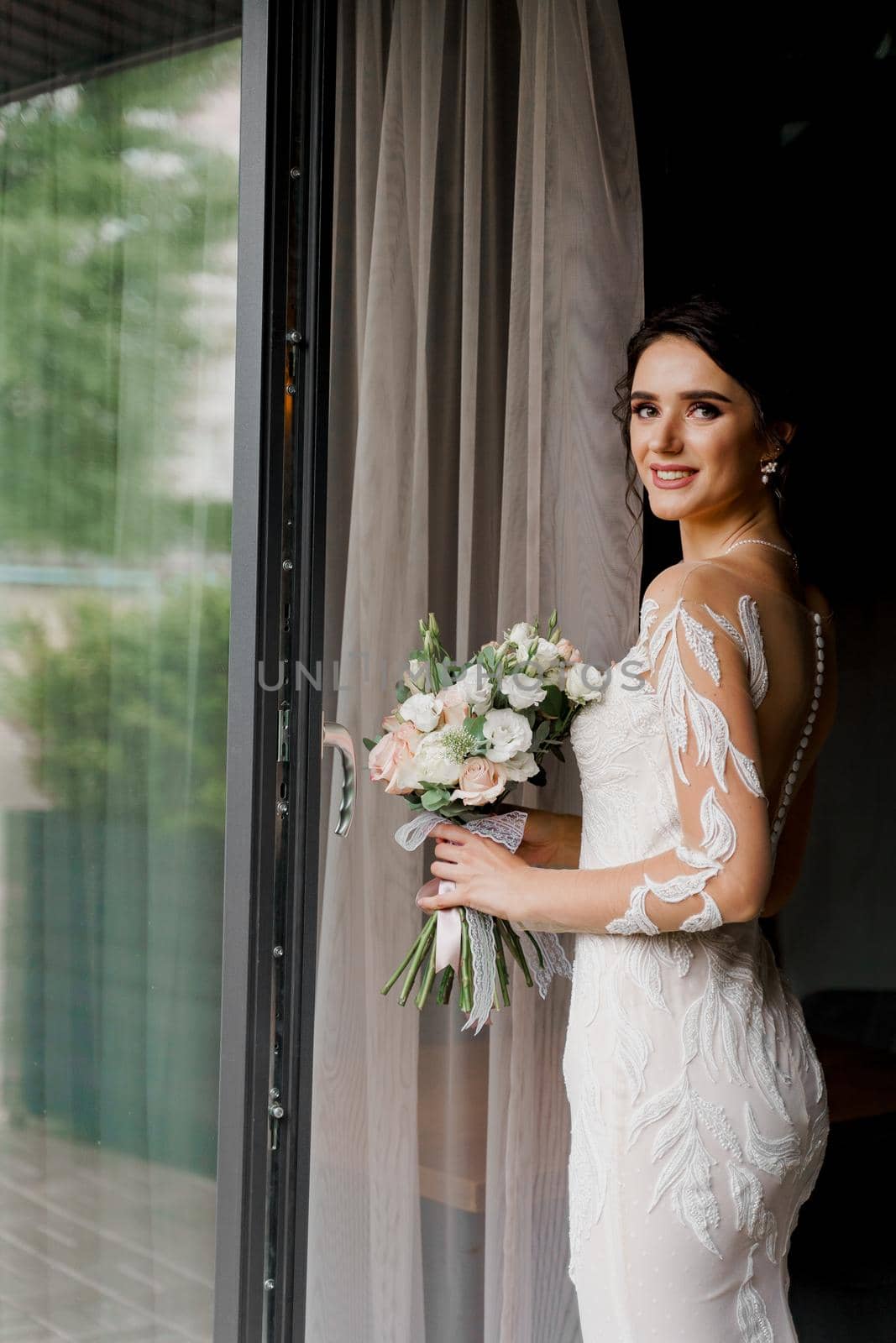 Bride in wedding dress and bridal veil in cafe. Advert for social networks for wedding agency and bridal salon