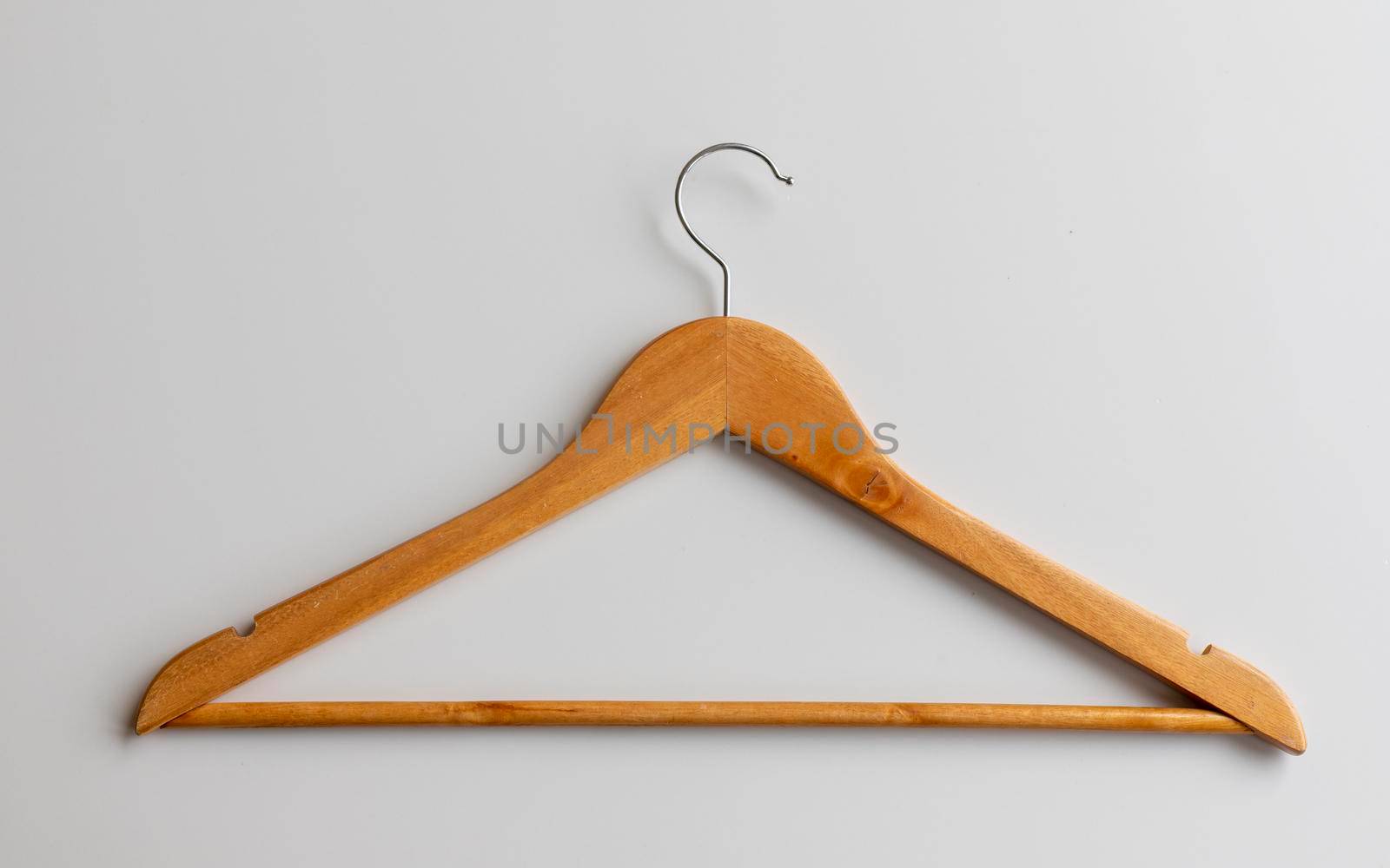 Wooden hanger on white isolated background