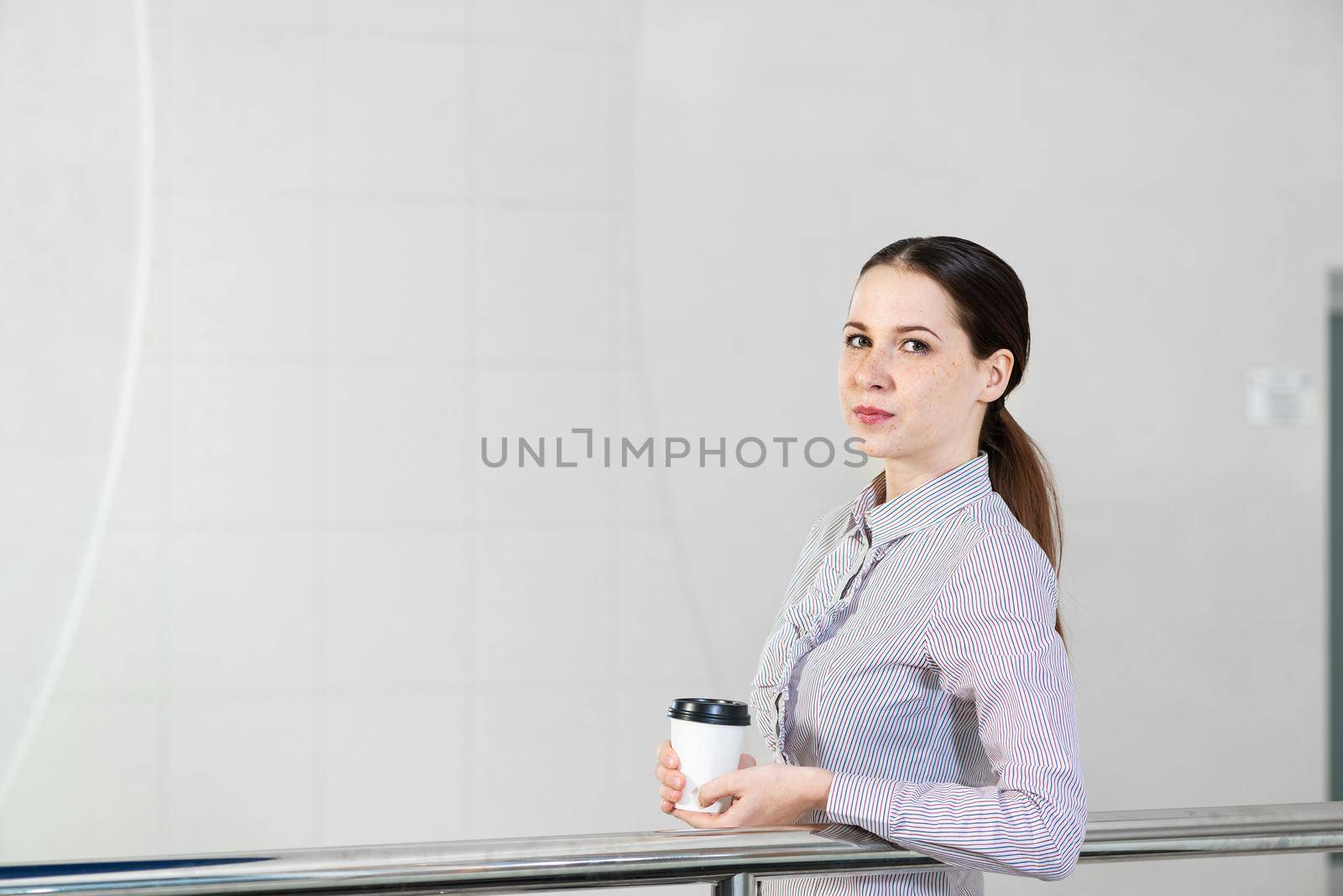 young attractive business woman with a cup of coffee by adam121