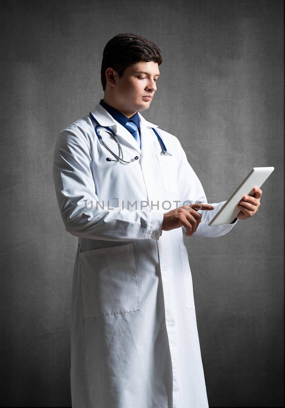 The doctor with the computer tablet. Digital technology in healthcare
