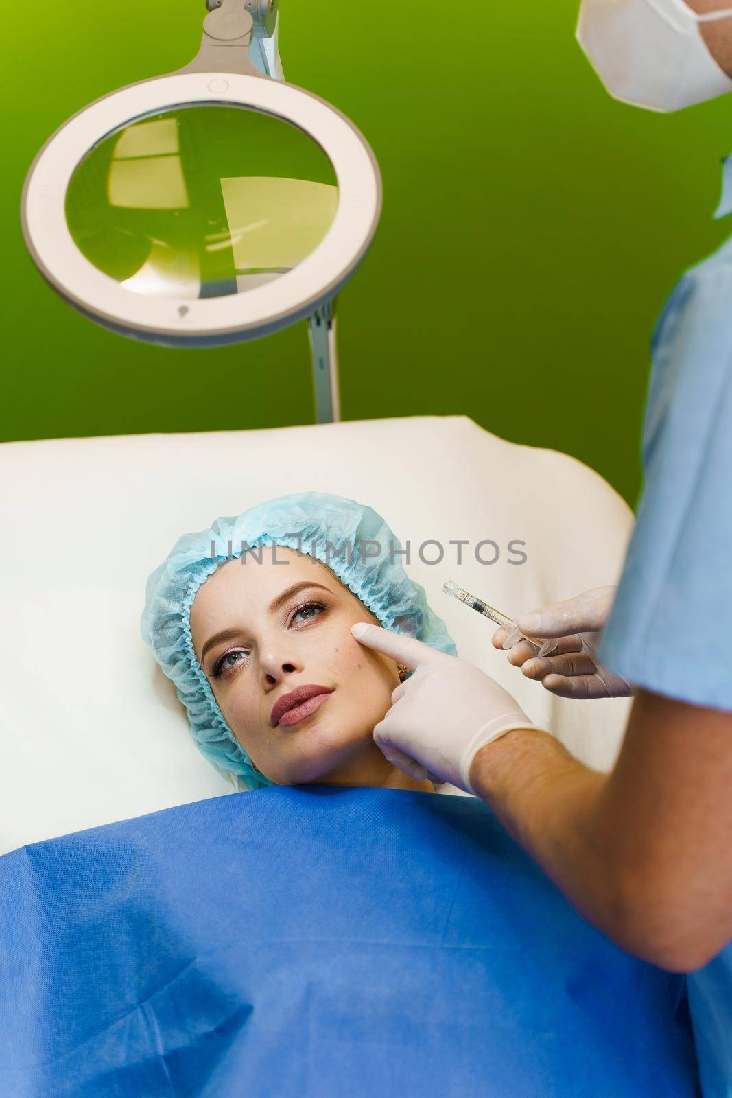 Filler injection in cheekbones. Contour plastic for correcting the volume and shape of the nose, chin, cheekbones, temples