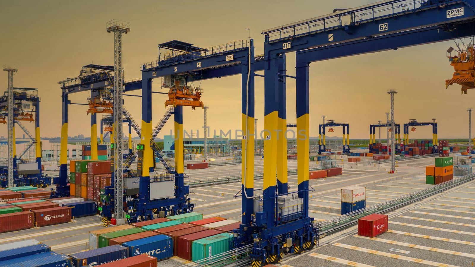 Industrial container yard with crane for business logistic import export, Crane loading cargo container to container ship in the international terminal yard container depot sea port freight shipping. by AvigatoR