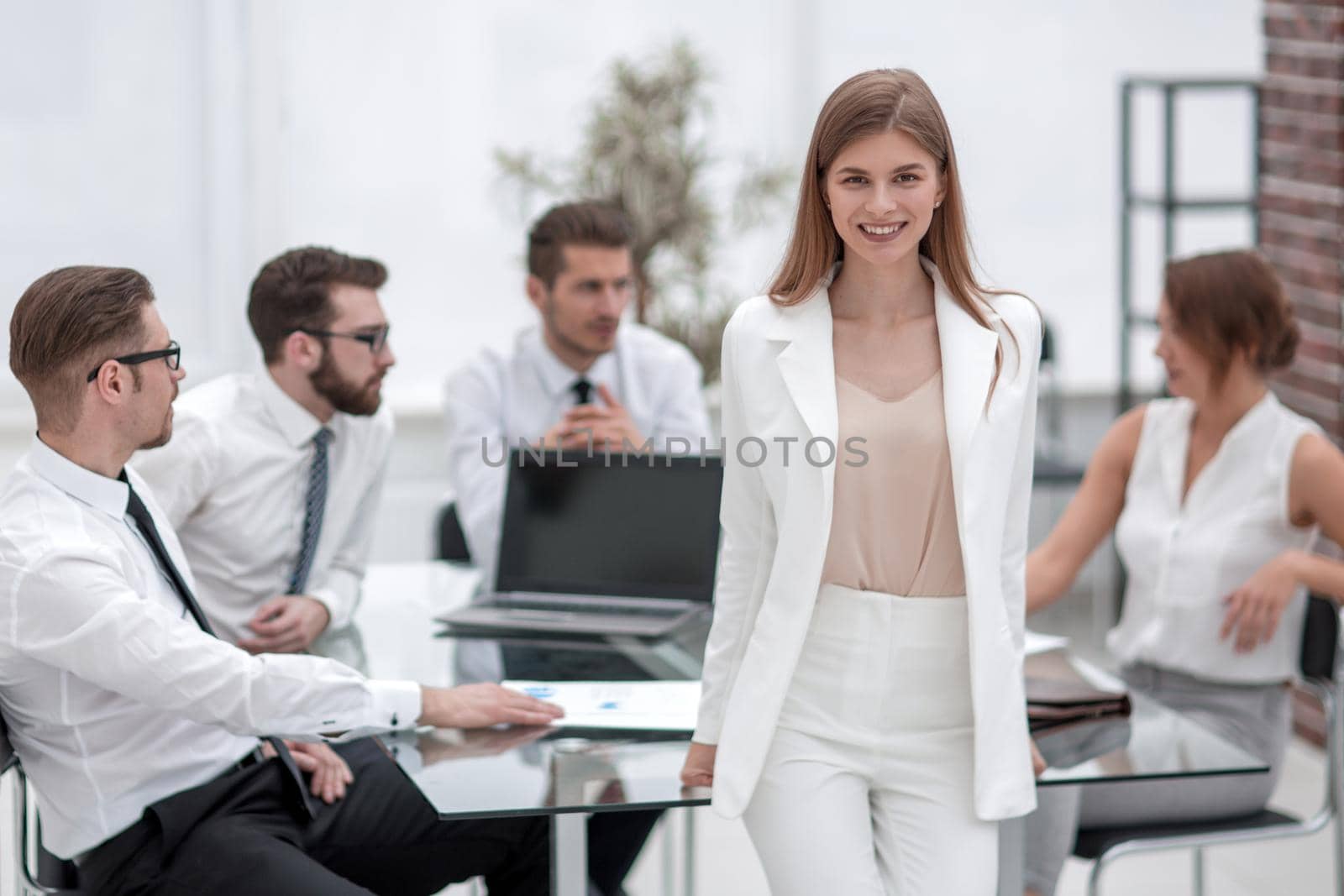young business woman standing near her Desk by asdf