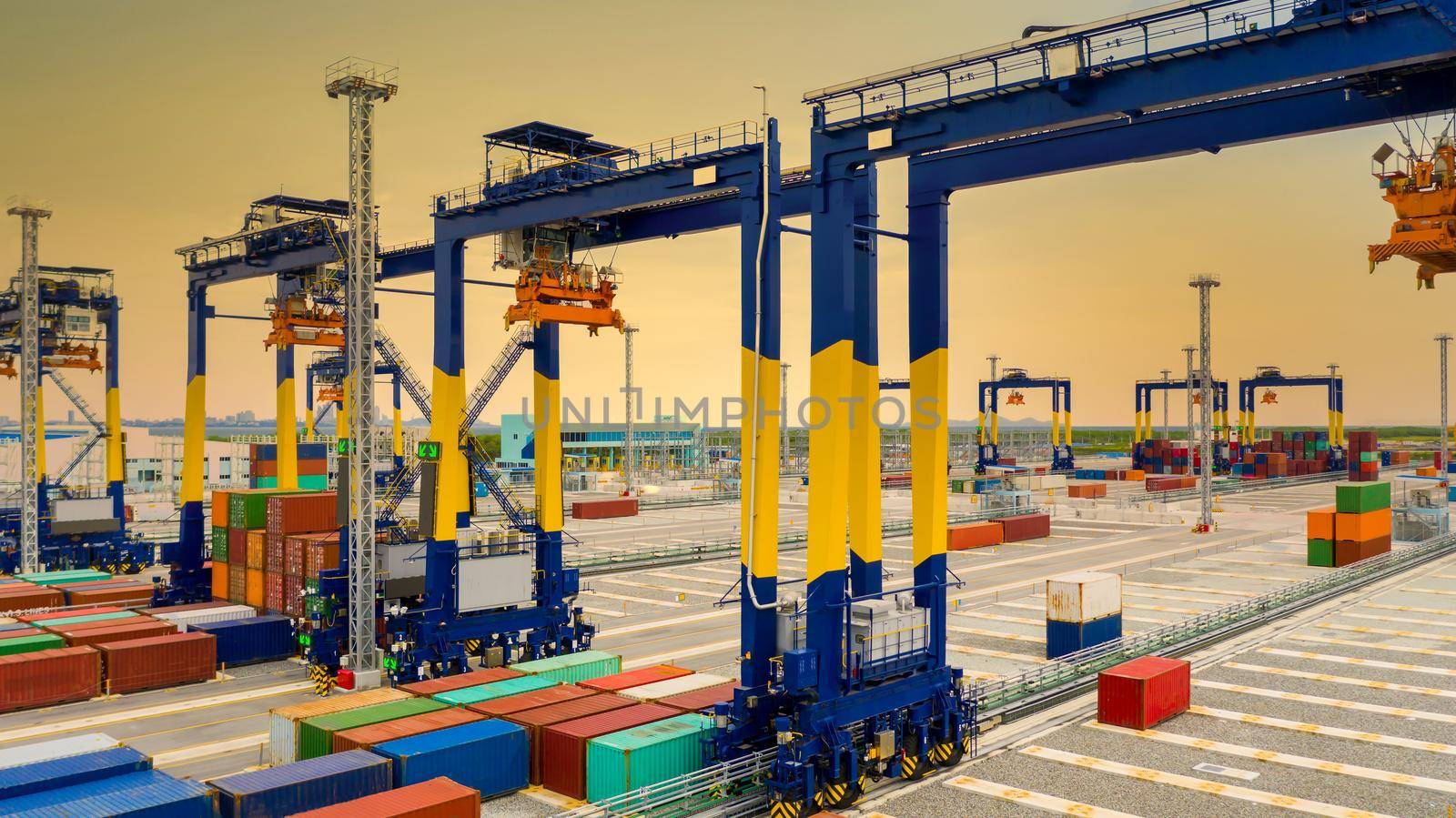 Industrial container yard with crane for business logistic import export, Crane loading cargo container to container ship in the international terminal yard container depot sea port freight shipping. by AvigatoR