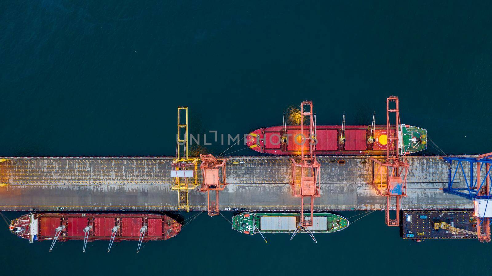 Aerial view bulk carrier dock, Global business import export logistic and transportation company, Commercial dock container cargo vessel freight shipping worldwide. by AvigatoR