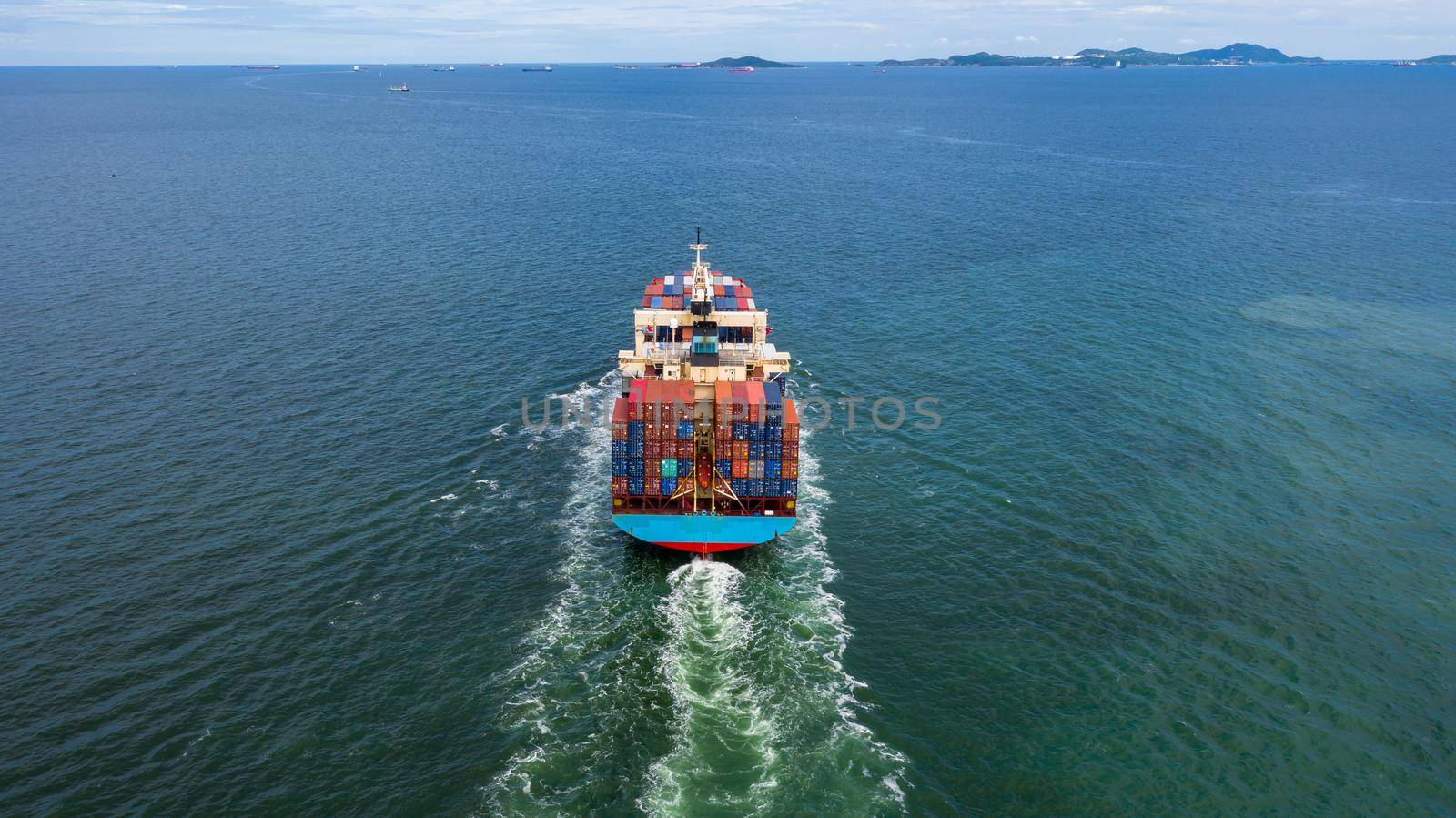 Container ship leaving the industrial seaport, Global business Import export, Company business logistic and transportation international by container cargo freight ship in the open sea.