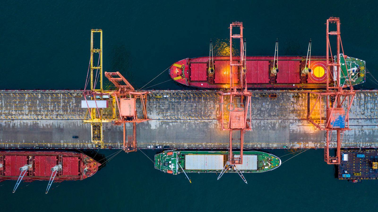 Aerial view bulk carrier dock, Global business import export logistic and transportation company, Commercial dock container cargo vessel freight shipping worldwide. by AvigatoR