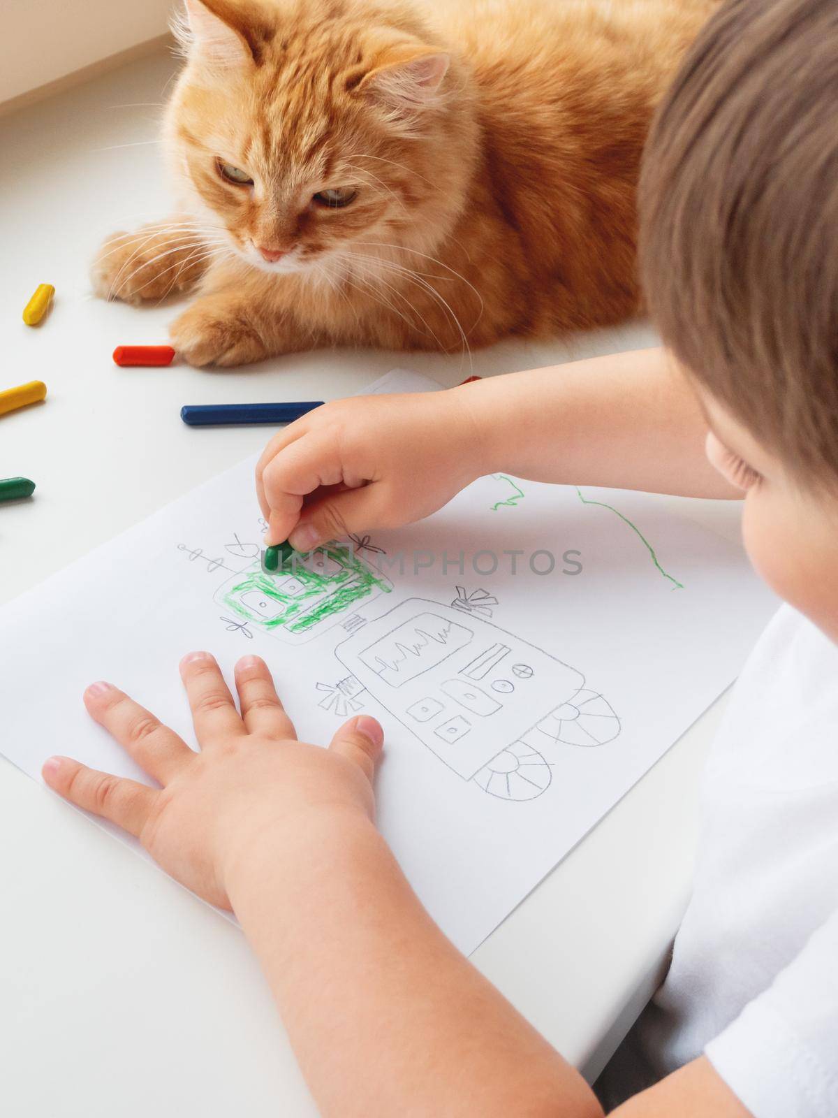 Toddler draws colorful robot. Kid uses wax crayons to paint it. Cute ginger cat lies on window sill with child. Coloring pages to train fine motor skills.