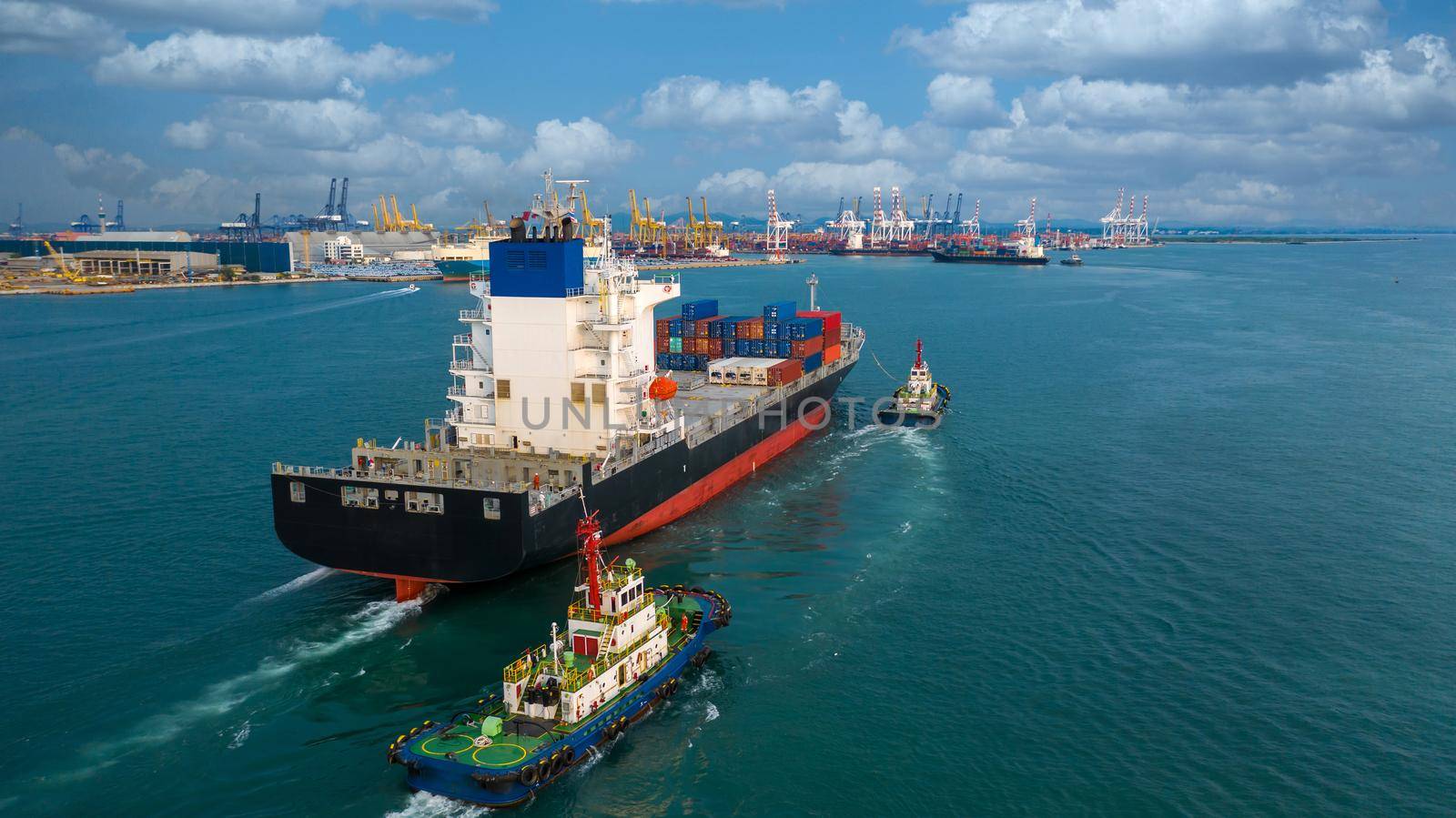 Container ship carrying container box in import export to commercial port, Global business cargo freight shipping commercial trade logistic and transportation oversea worldwide by container vessel.