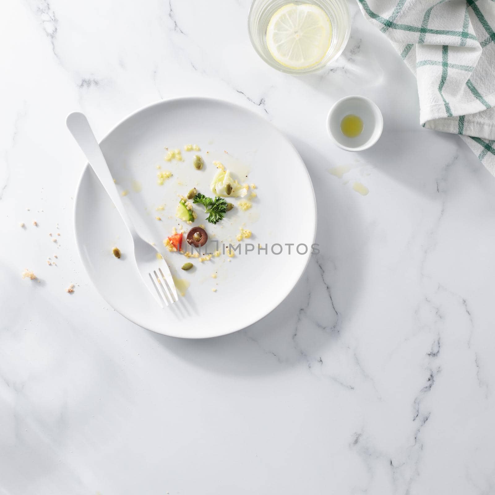 Empty dirty white plate with Vegetable Salad top view