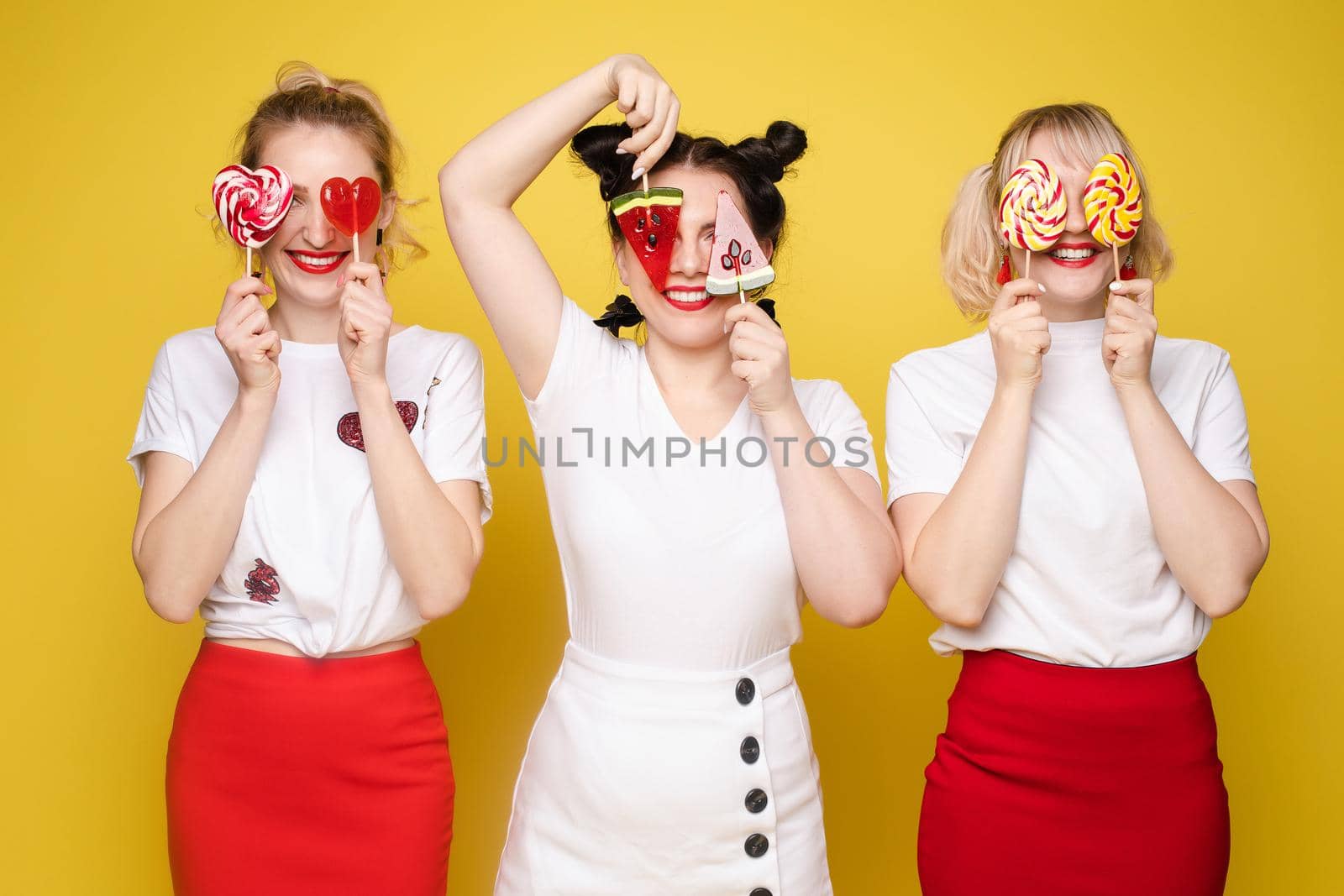 Three beautiful woman celebrating a party and having fun by StudioLucky