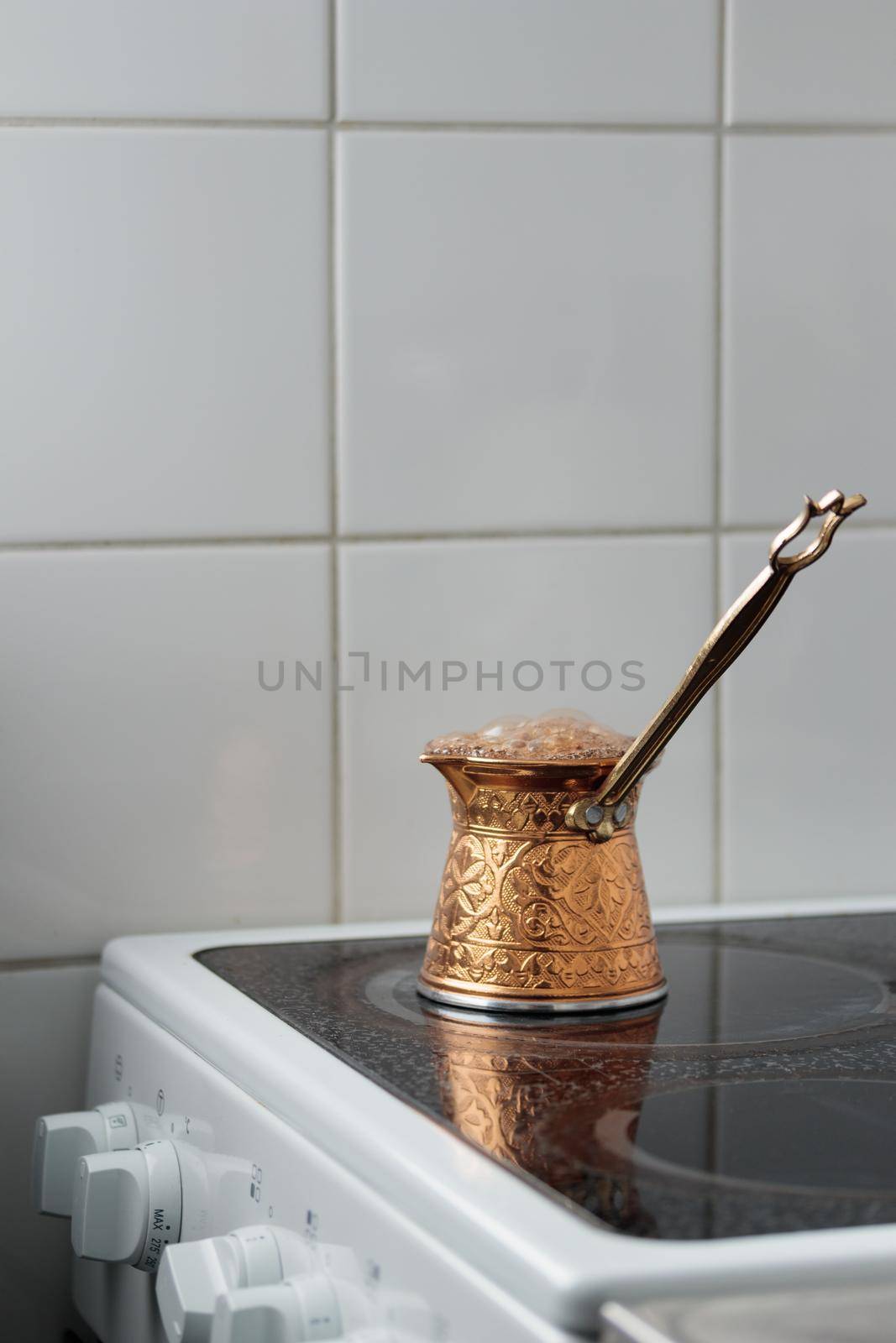 Runaway turkish coffeein a cezve on a stove