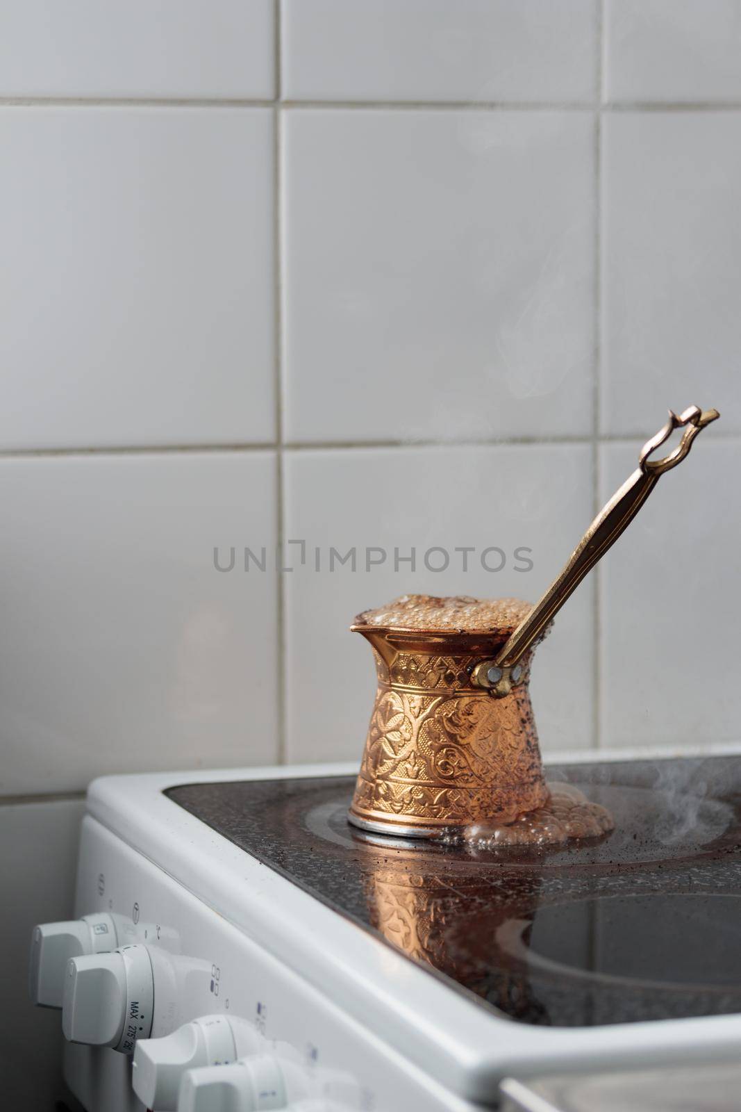 Runaway turkish coffeein a cezve on a stove