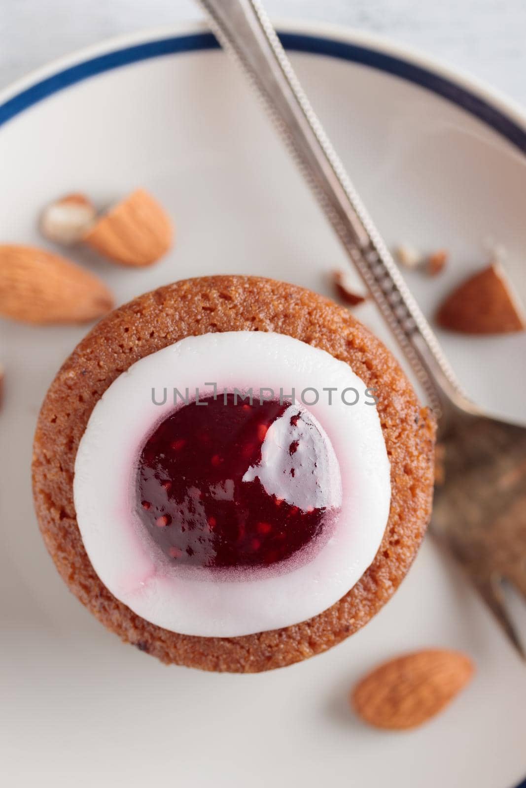 Runebergin Torttuu in a plate on a white table vertical