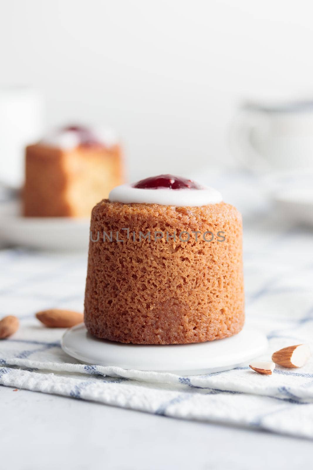 Runebergin Torttuu in a plate on a white table vertical