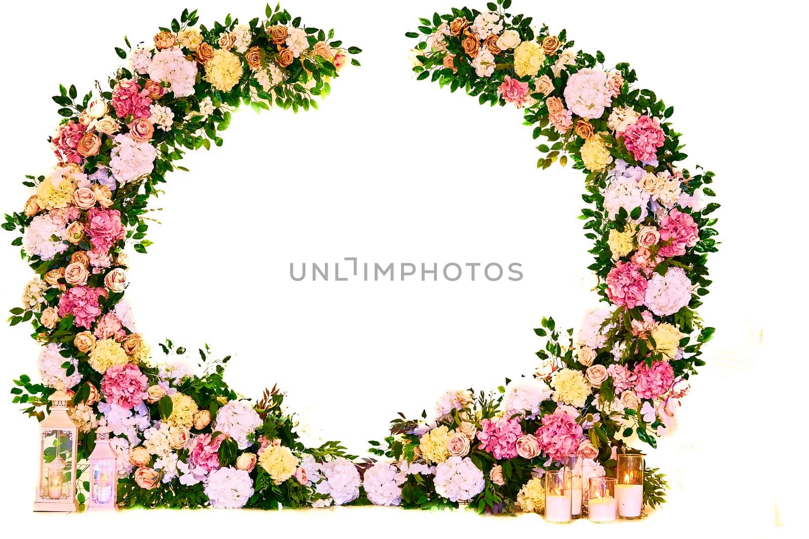 an arrangement of flowers, leaves, or stems fastened in a ring and used for decoration or for laying on a grave.