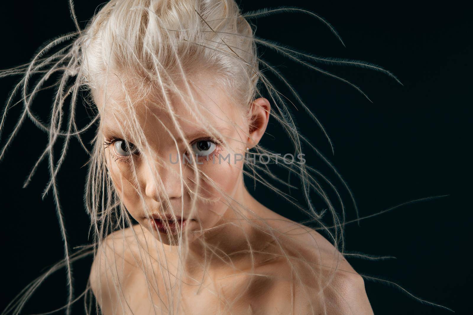 Portrait of a girl with lively curly hair. A young gorgon jellyfish from mythology. Art object