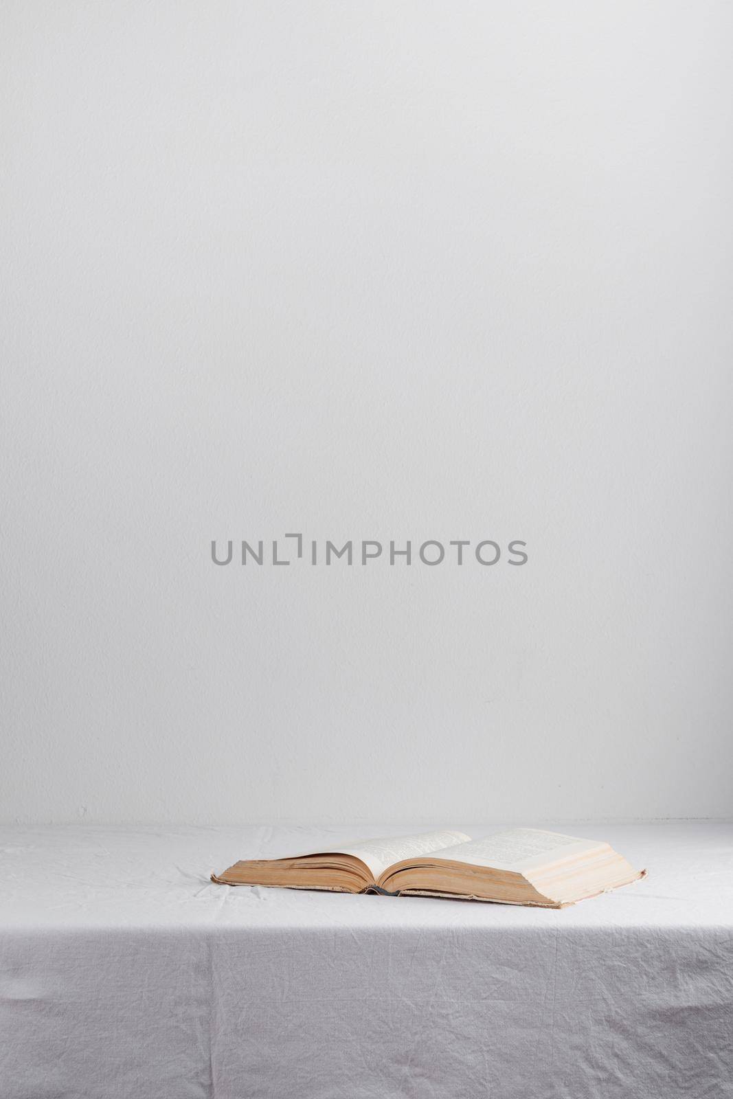 Stack of old rustic vintage books by Gudzar