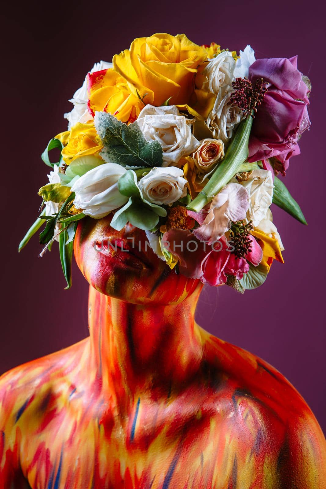 A girl with fresh flowers on her head. Flower Man