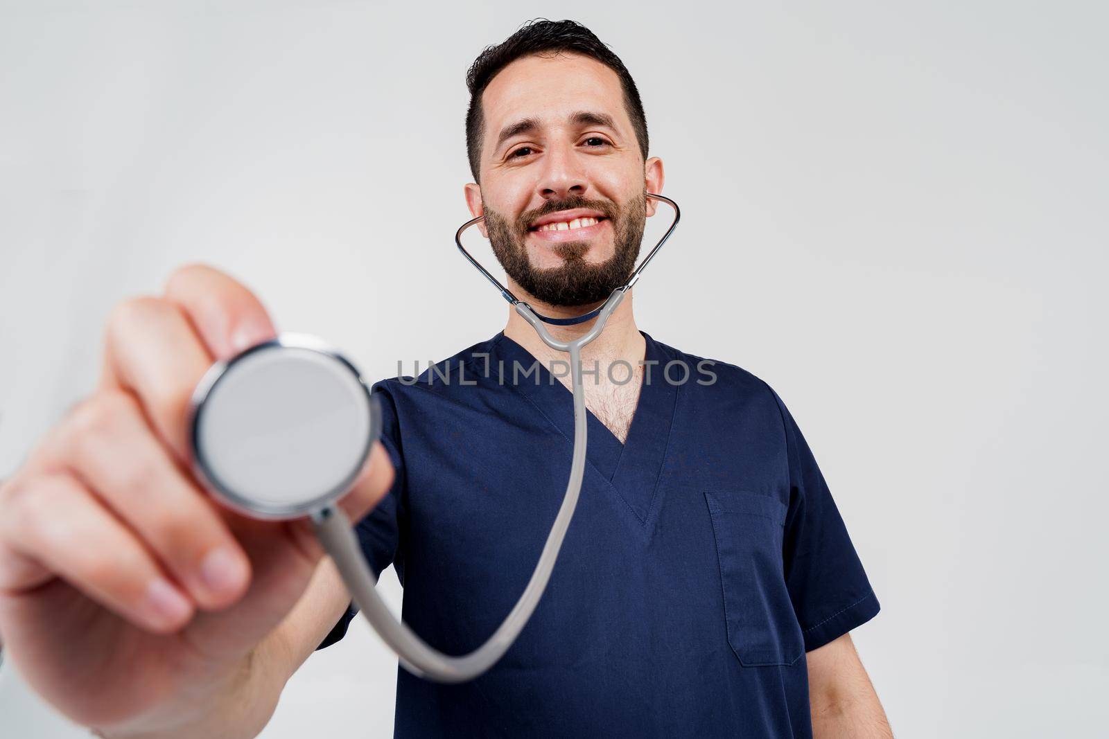 Medical arabian student does auscultation to patient. Doctor uses phonendoscope for auscultation. Medical therapy and treatment. by Rabizo