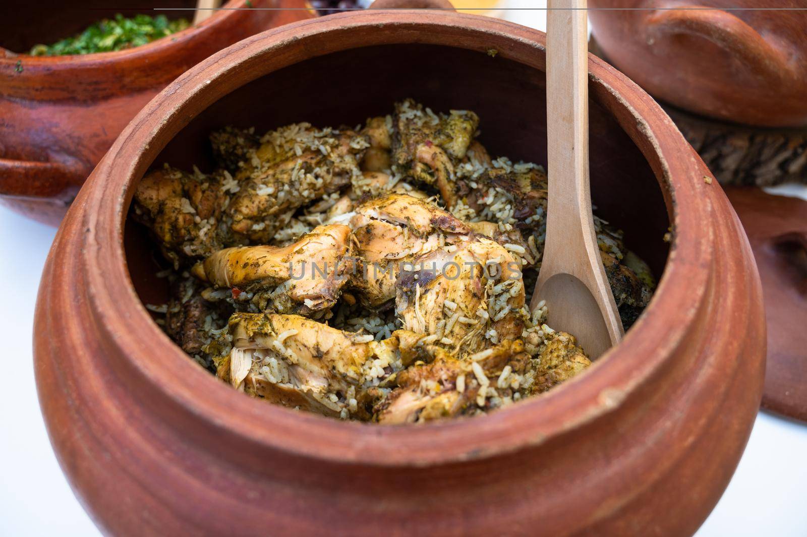 Peruvian cuisine: Chicken and rice called arroz con pollo in a clay pot