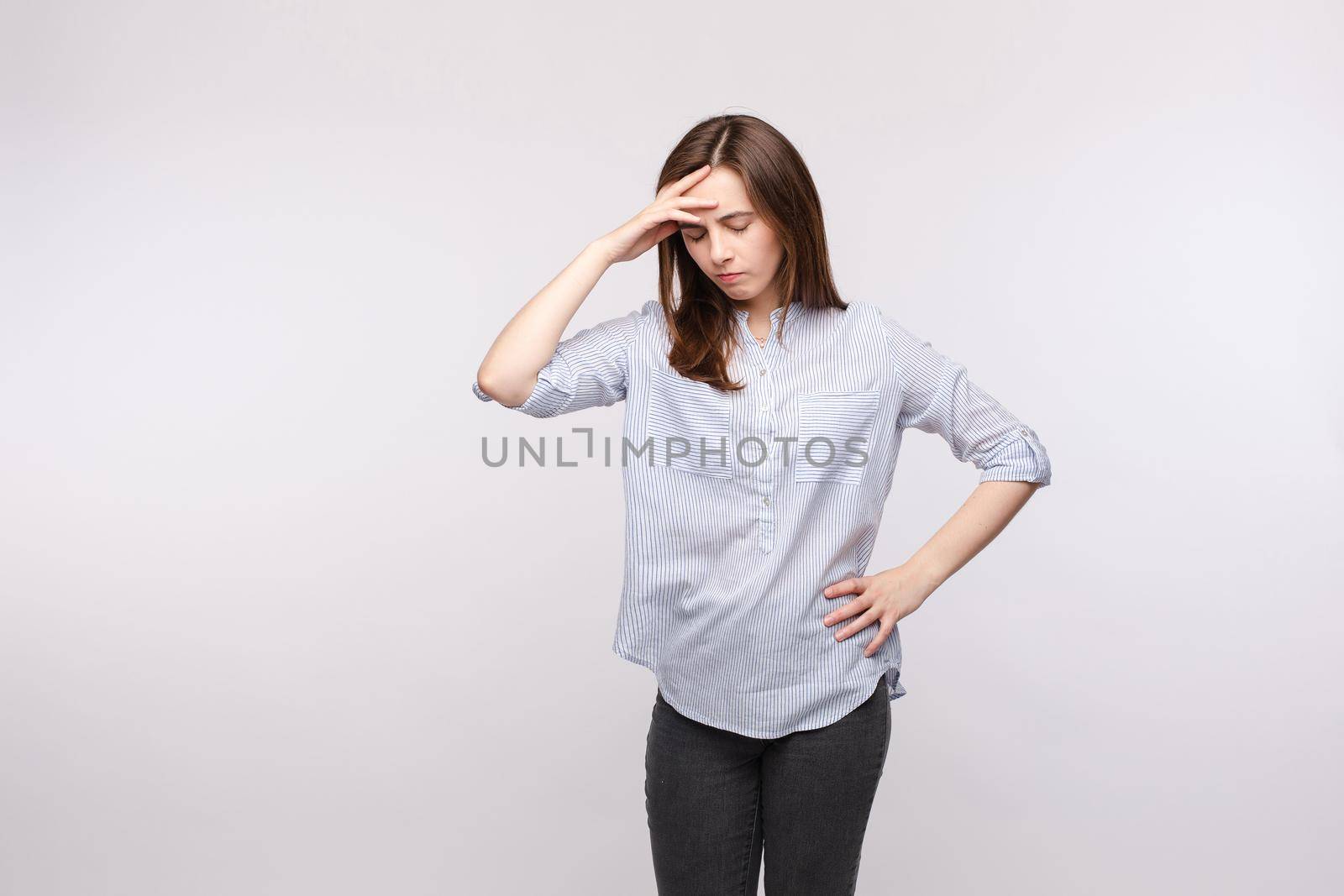 Woman with a headache and closed eyes. by StudioLucky