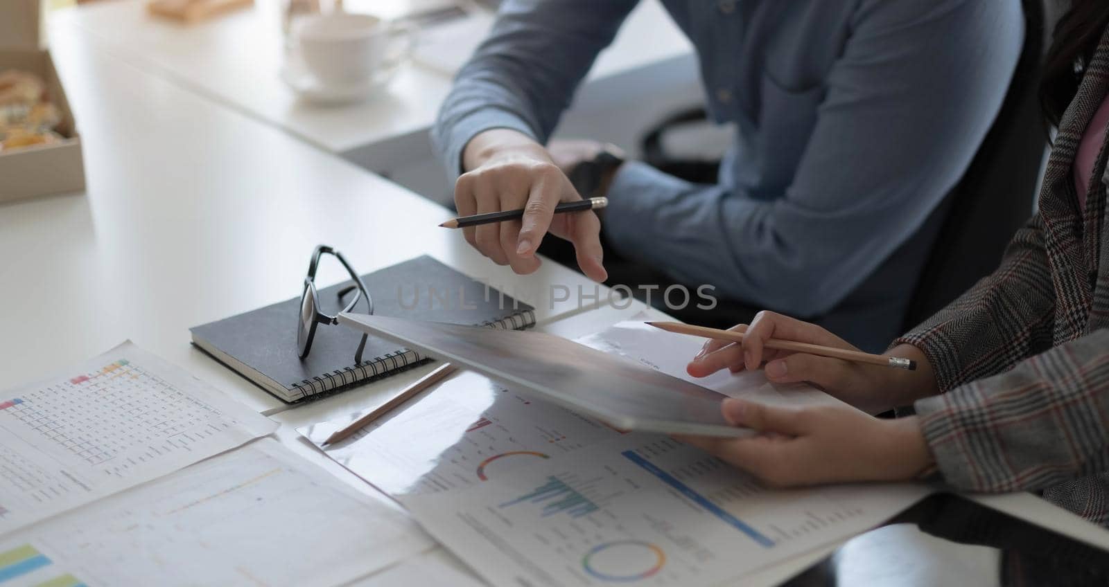 Team of business people working together in the meeting room office, teamwork background charts and graphs banner, double exposure successful teamwork,business planning concept. by wichayada