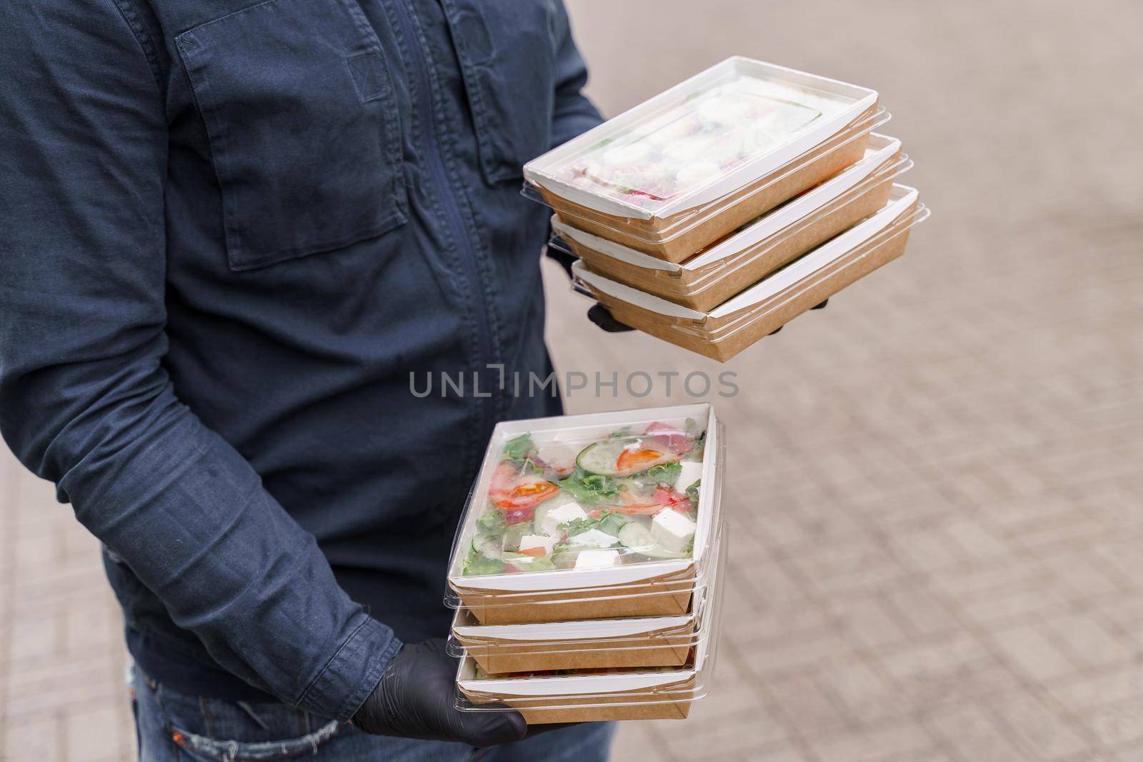 Green natural salads in eco organic boxes. Biodegradable disposable tableware