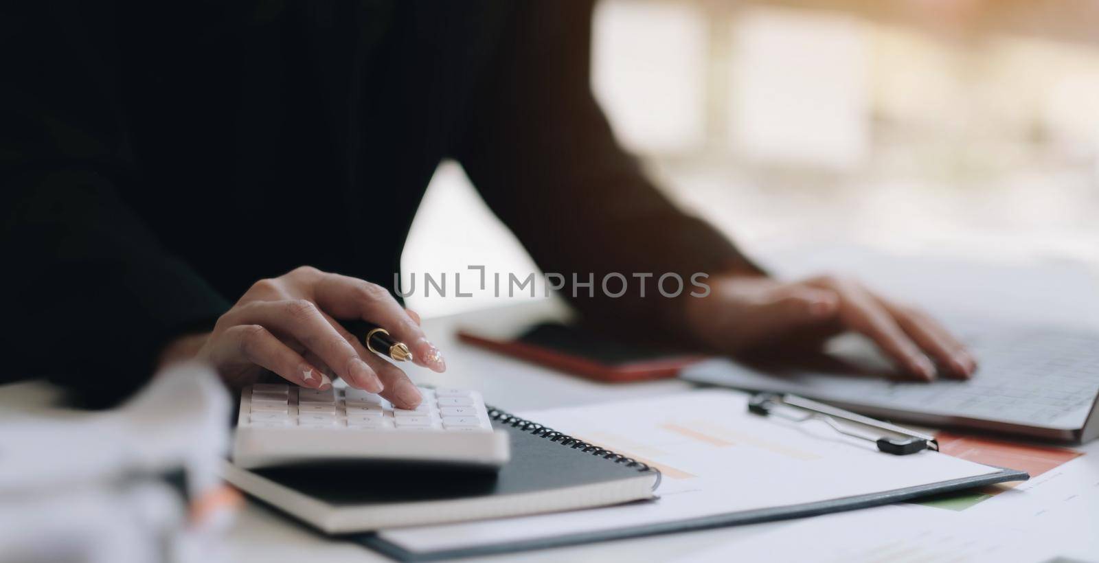 Close up view of bookkeeper or financial inspector hands making report, calculating or checking balance. Home finances, investment, economy, saving money or insurance concept.