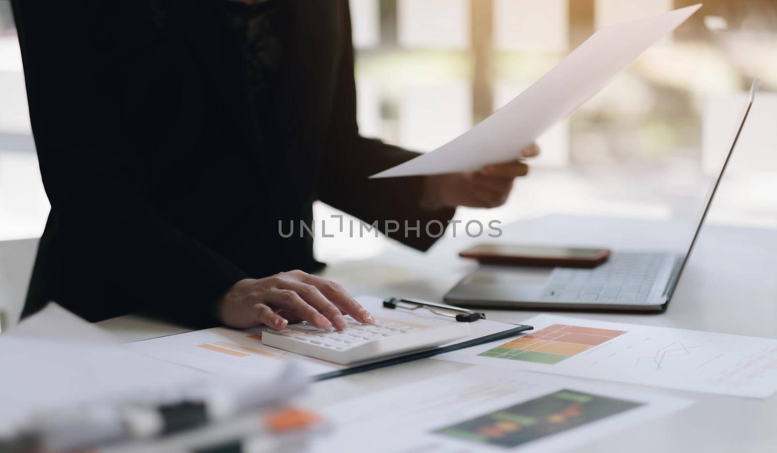 Close up view of bookkeeper or financial inspector hands making report, calculating or checking balance. Home finances, investment, economy, saving money or insurance concept.